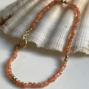 armband zonnesteen en goud